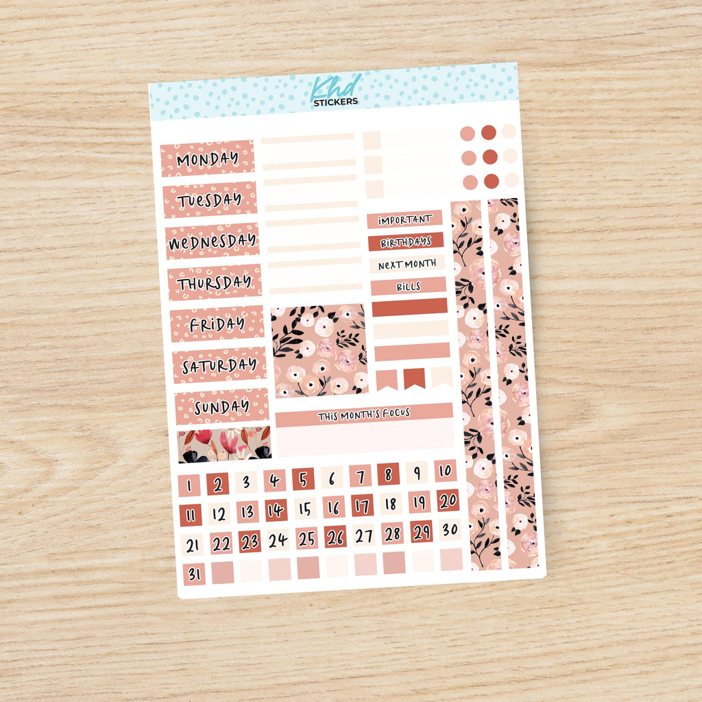 a planner sticker with a floral pattern on it