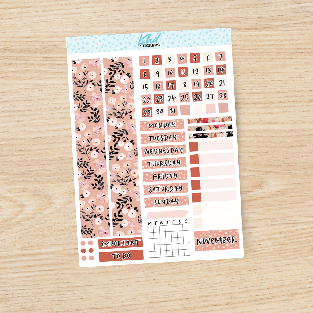 a planner sticker with a floral pattern on it