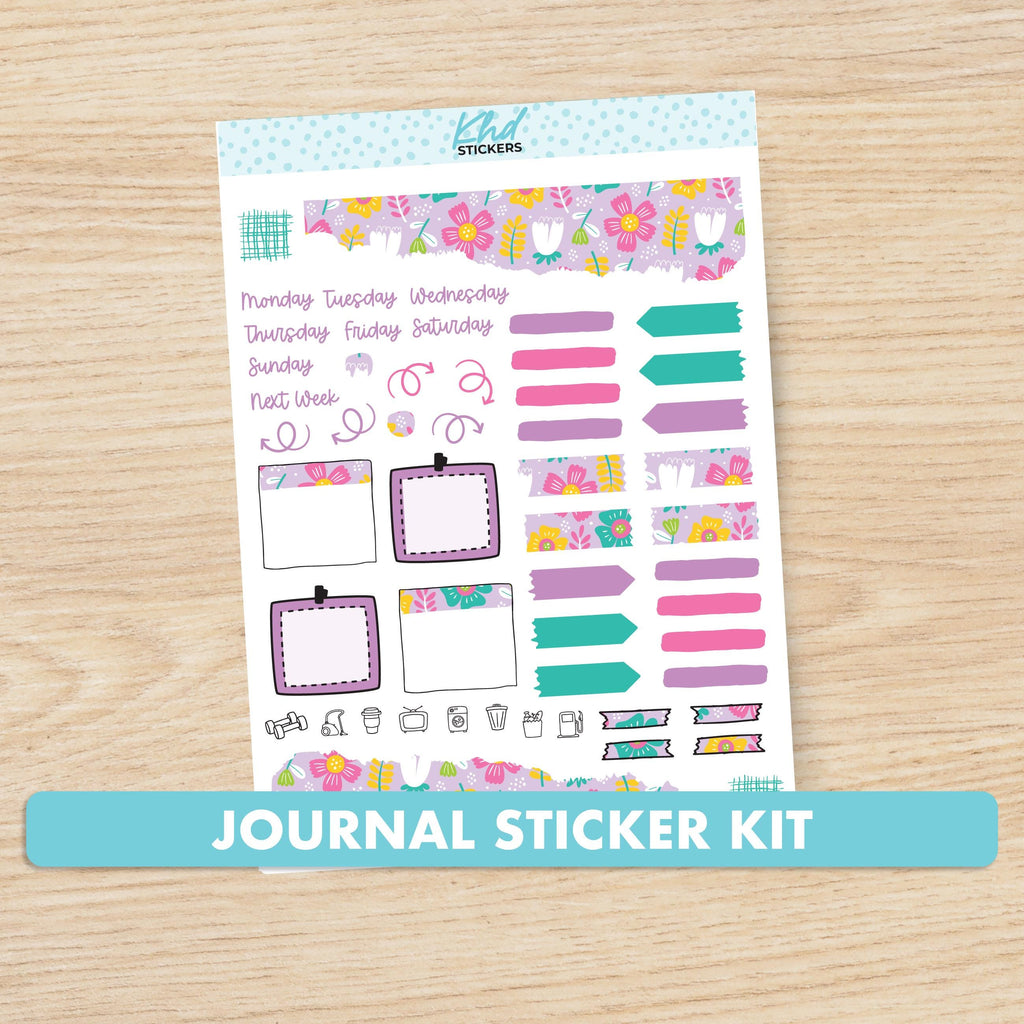 a planner sticker kit with a wooden background